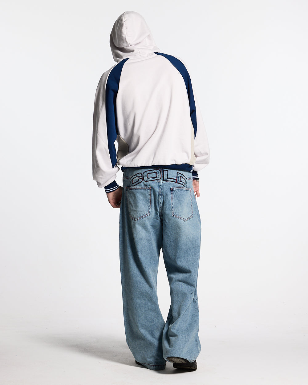 COWBOY V1 PANTS BLUE DENIM - light blue baggy denim pants, back view on male model - Cold Culture