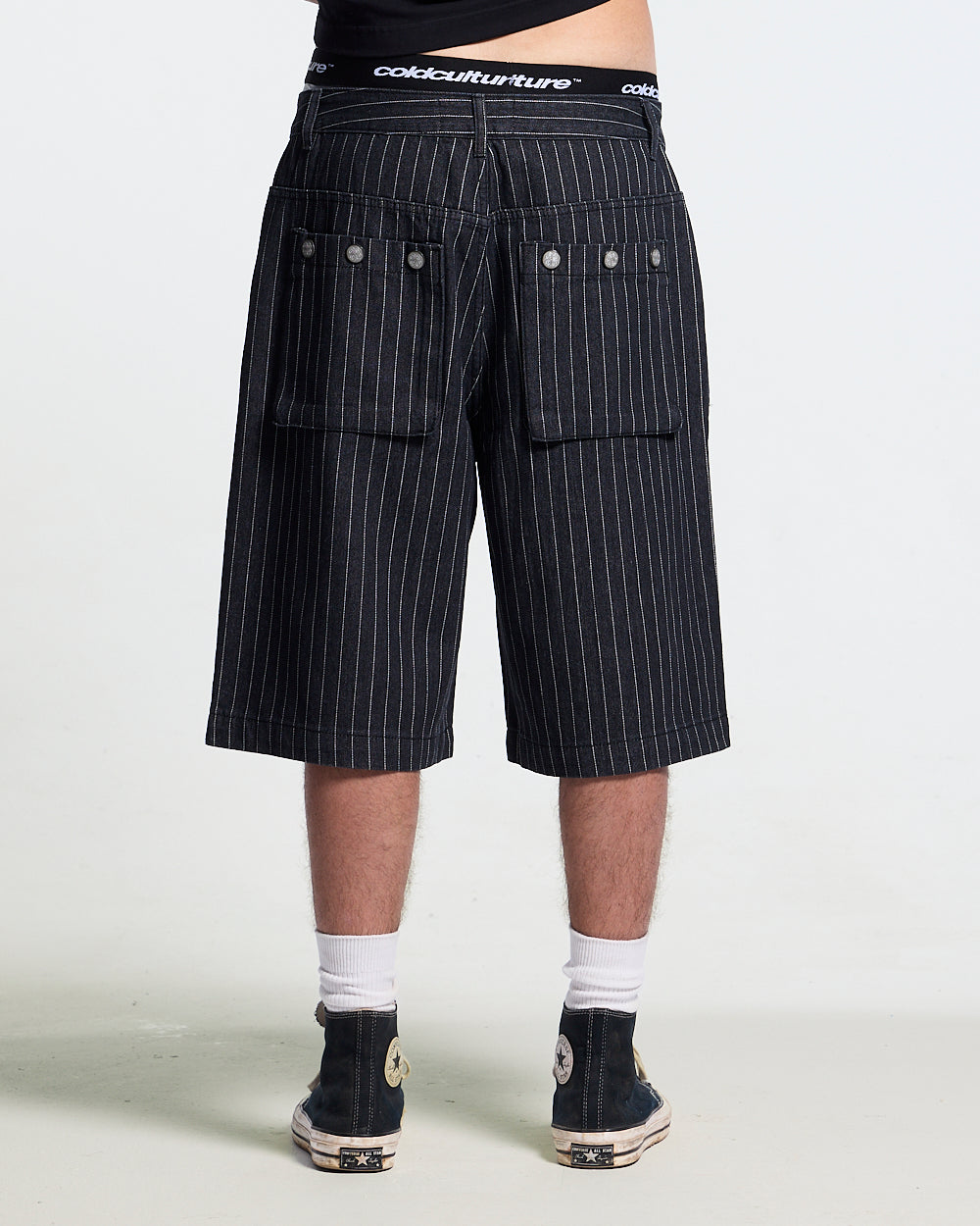 CASINO SHORT BLACK - black pinstripe shorts, back view on male model - Cold Culture