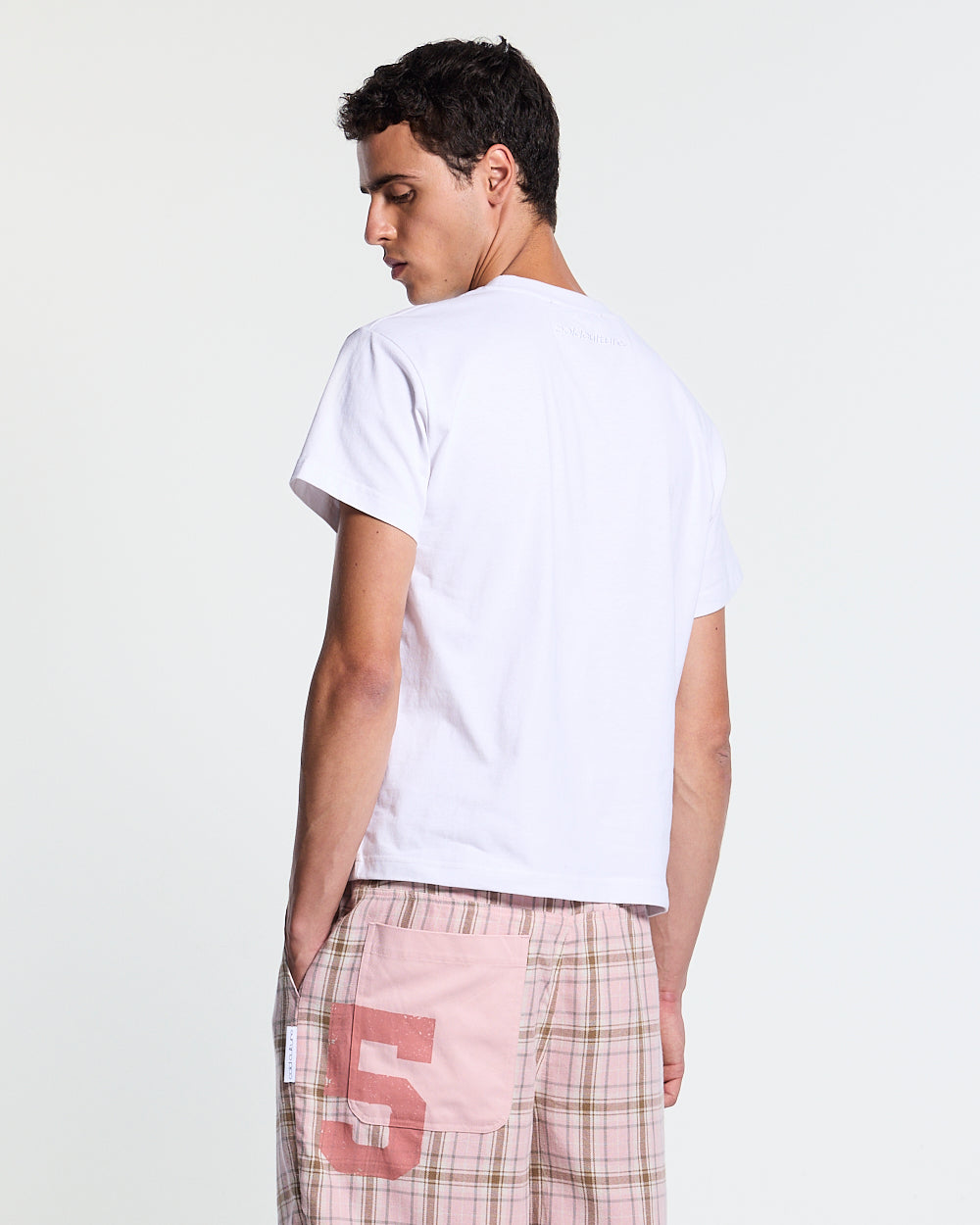 BLING TEE WHITE - white rhinestone script tee, back view on male model - Cold Culture #man
