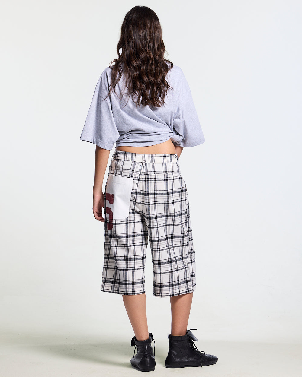 DINING CHECK JORTS BLACK - black and white checkered shorts, back view on female model - Cold Culture #woman