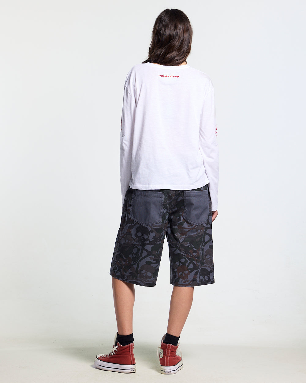 NIGHTSKULL SHORTS GREY - grey skull camo shorts, back view on female model - Cold Culture #woman