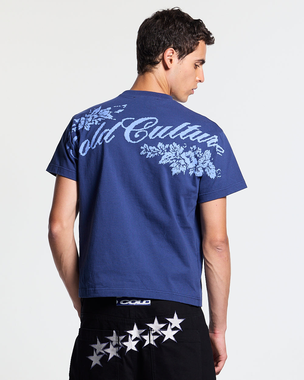 BLOOM TEE NAVY - navy floral print tee, back view on male model - Cold Culture #man