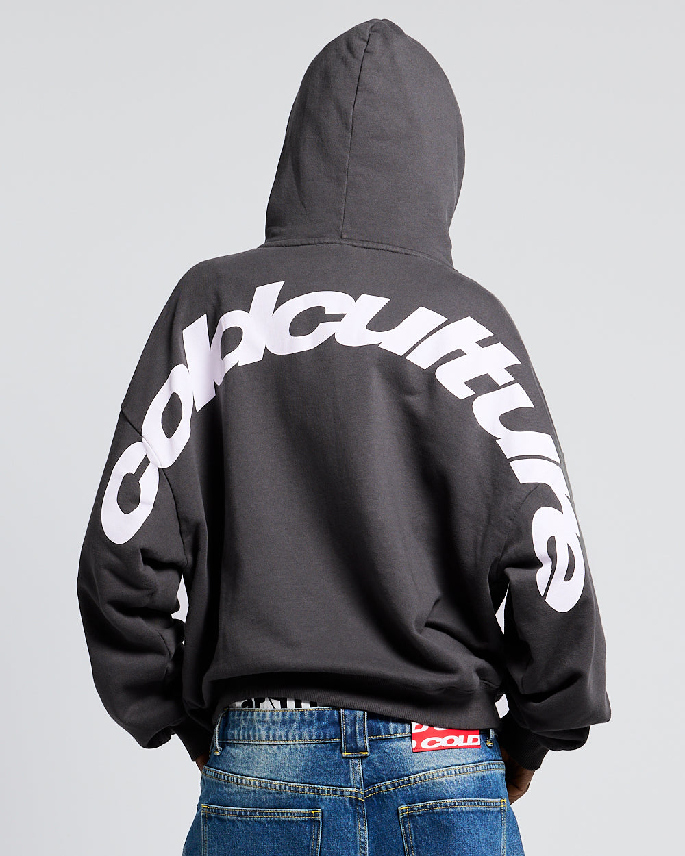 CURVED HOODIE HEAVY GREY - dark grey oversized hoodie, back view on female model - Cold Culture #woman