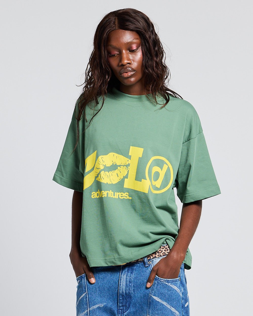 ADVENTURES TEE GREEN & YELLOW - green graphic print tee, front view on female model - Cold Culture #woman