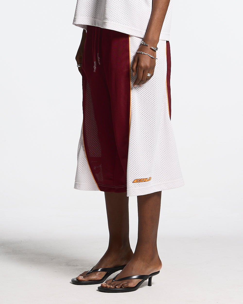 AERO STEED SHORT CREAM/BURGUNDY - cream and burgundy mesh shorts, front view on female model - Cold Culture #woman