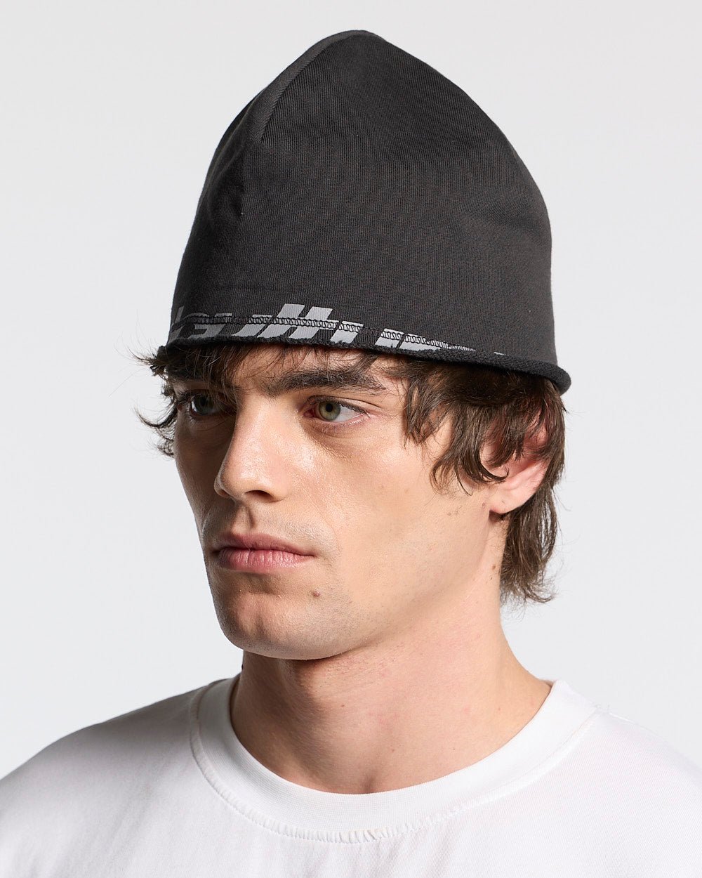 ARMOUR BEANIE BLACK - black logo beanie, on model close-up - Cold Culture #man