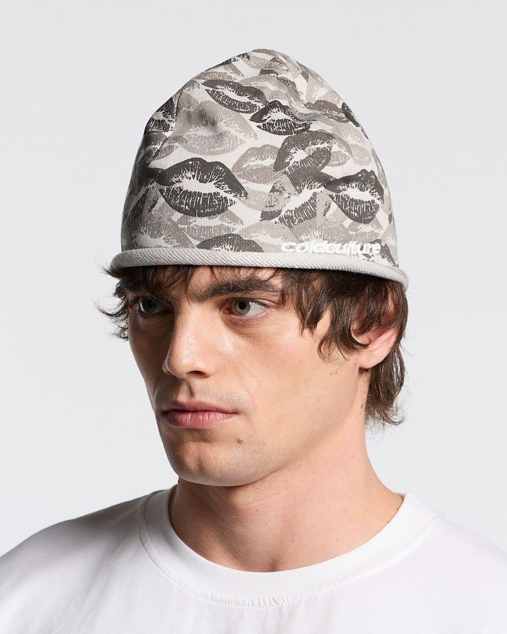 ARMOUR BEANIE LIGHT GREY - light grey graphic print beanie, on model close-up - Cold Culture #man
