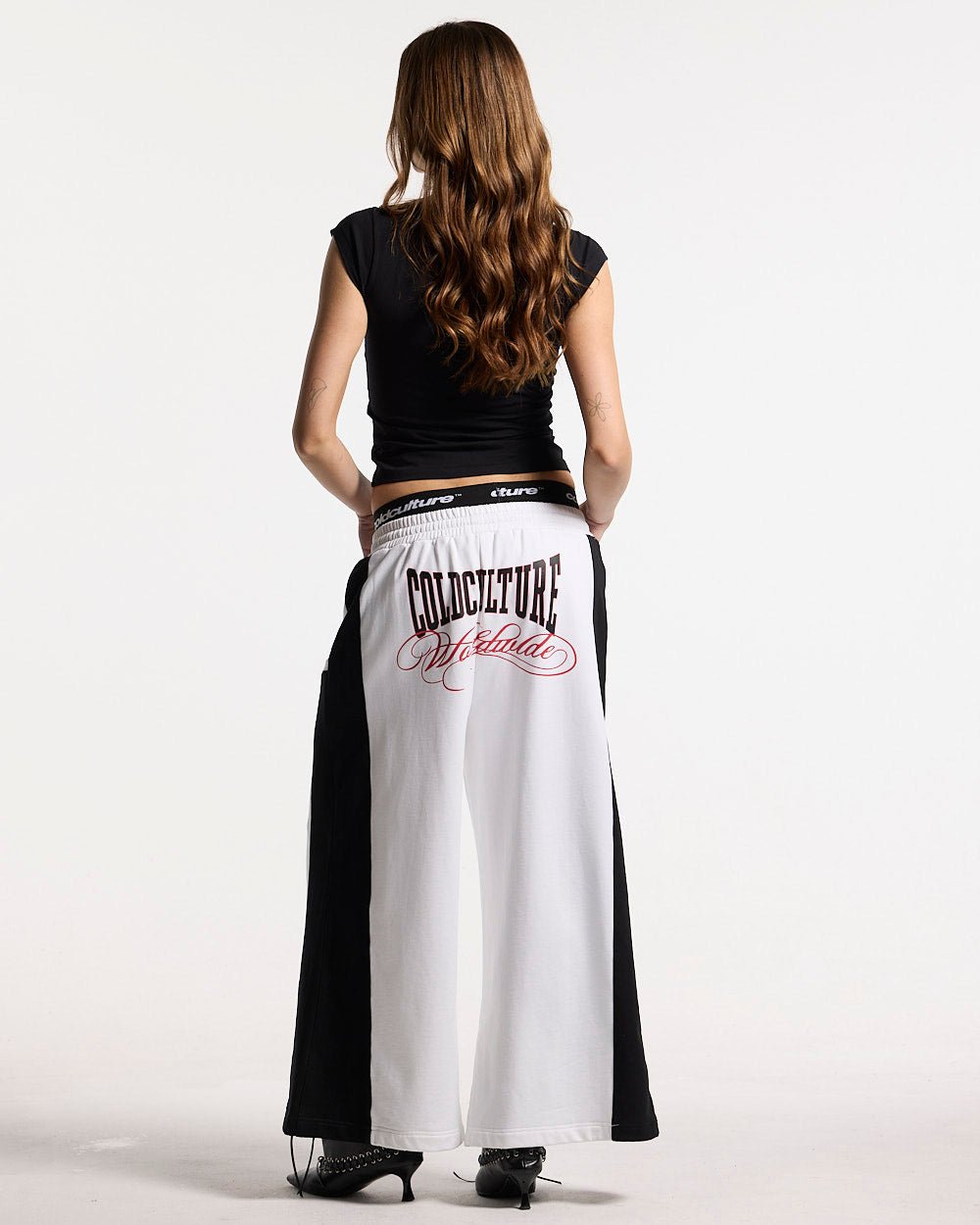 BLING BABY TEE BLACK - black fitted baby tee, back view on female model - Cold Culture #woman