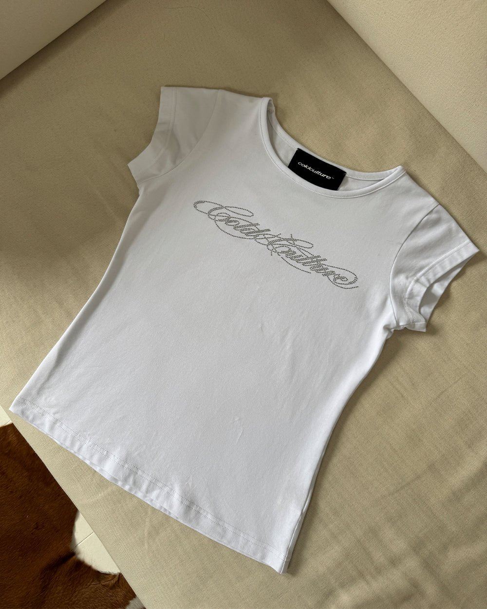 BLING BABY TEE WHITE - white rhinestone logo baby tee, flat lay - Cold Culture