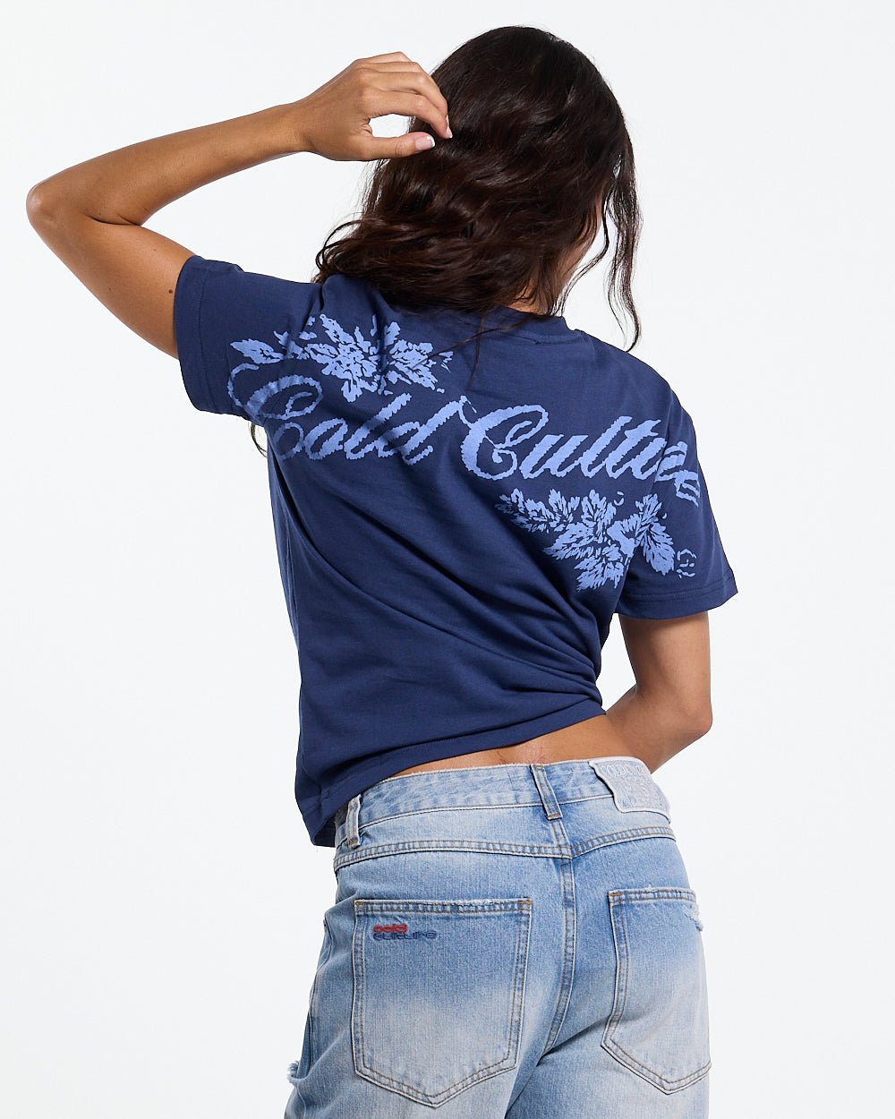 BLOOM TEE NAVY - navy floral print tee, back view on female model - Cold Culture #woman