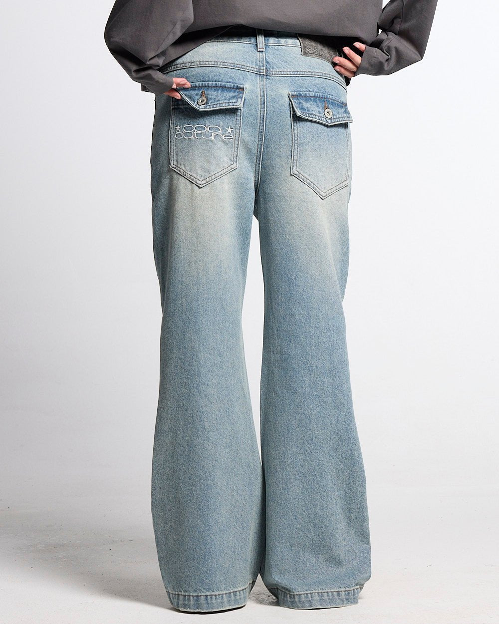BLURRED V5 BOOTCUT PANTS LIGHT DENIM - light wash denim bootcut pants, back view on female model - Cold Culture #woman
