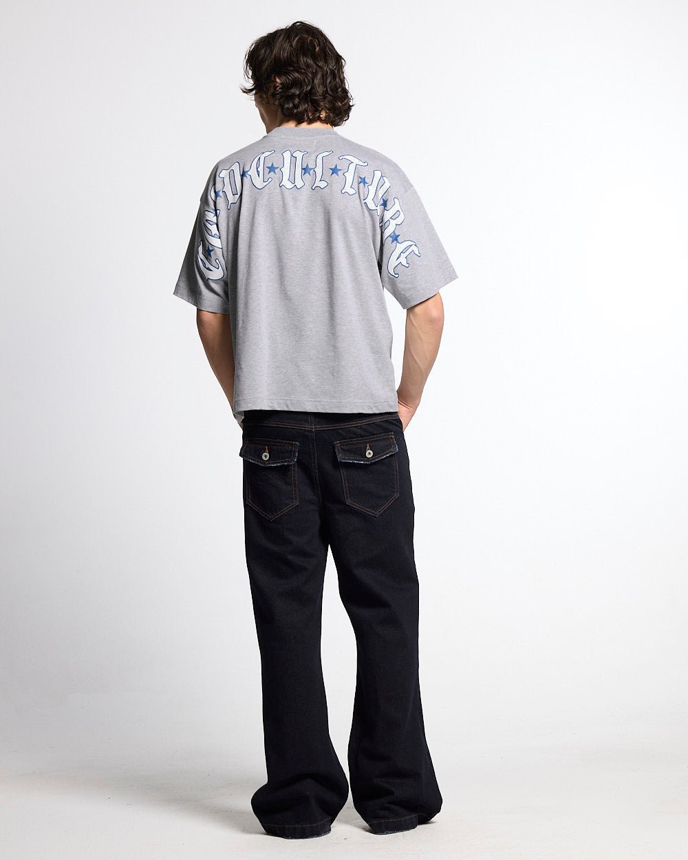 BLURRED V5 BOOTCUT PANTS RAW DENIM - raw denim bootcut pants, back view on male model - Cold Culture #man