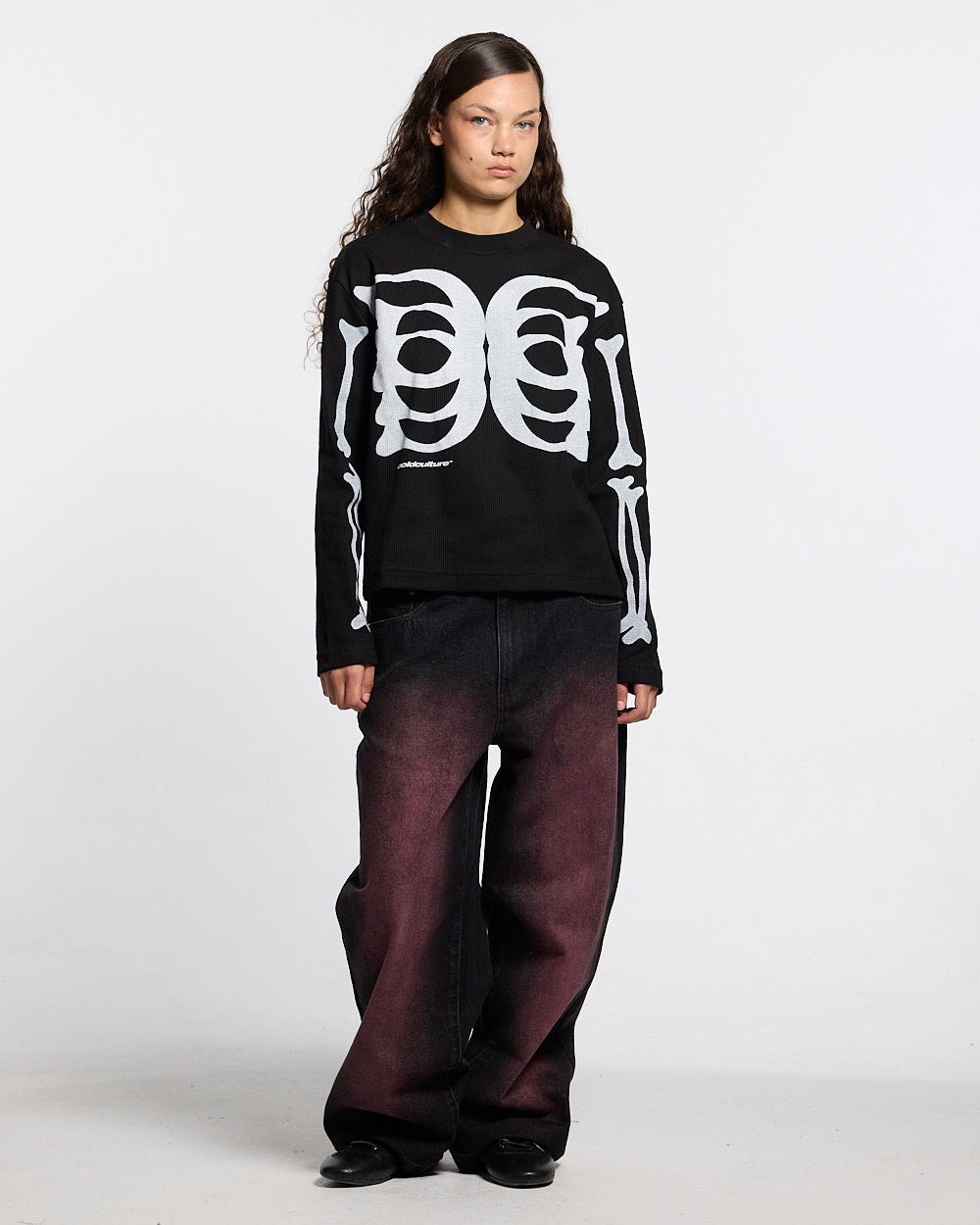 BONEY LONGSLEEVE BLACK - black skeleton print longsleeve tee, front view on female model - Cold Culture #woman