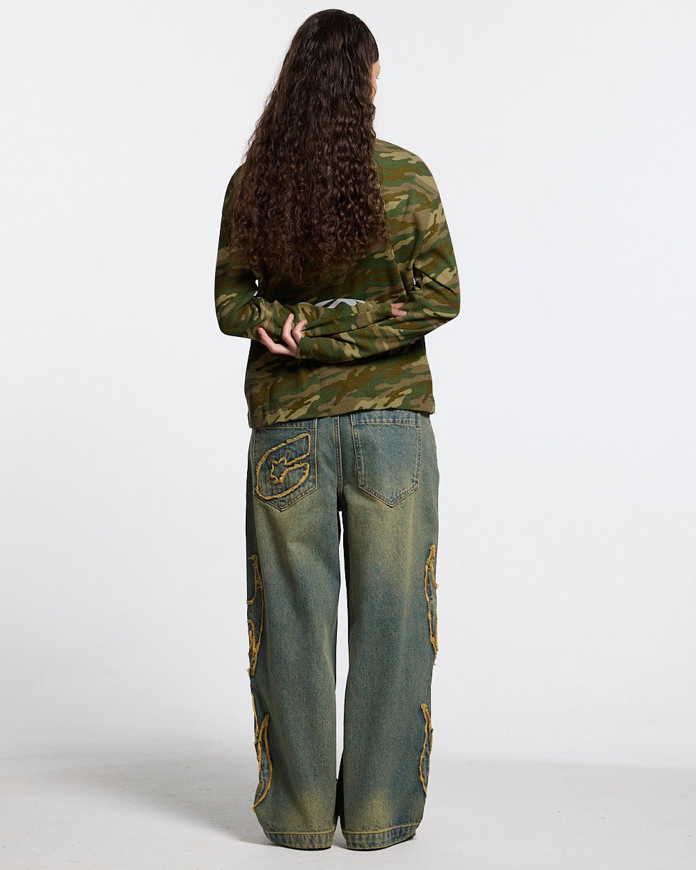BONEY LONGSLEEVE CAMO - camo skeleton print longsleeve tee, back view on female model - Cold Culture #woman