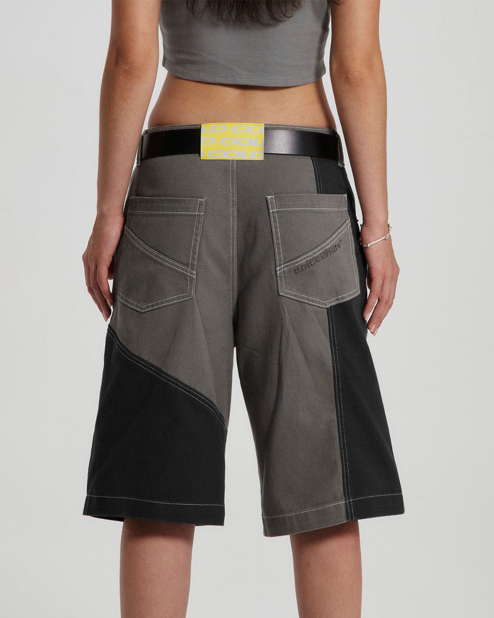 BUTTERFLY V2 SHORTS GREY/BLACK DENIM - grey black patchwork denim shorts, back view on female model - Cold Culture #woman