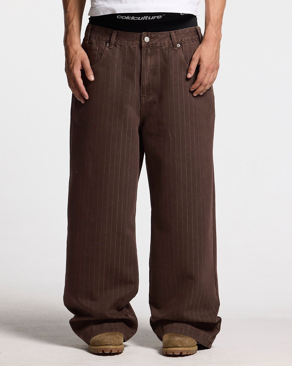 CASINO PANTS BROWN DENIM - brown pinstripe denim pants, front view on male model - Cold Culture