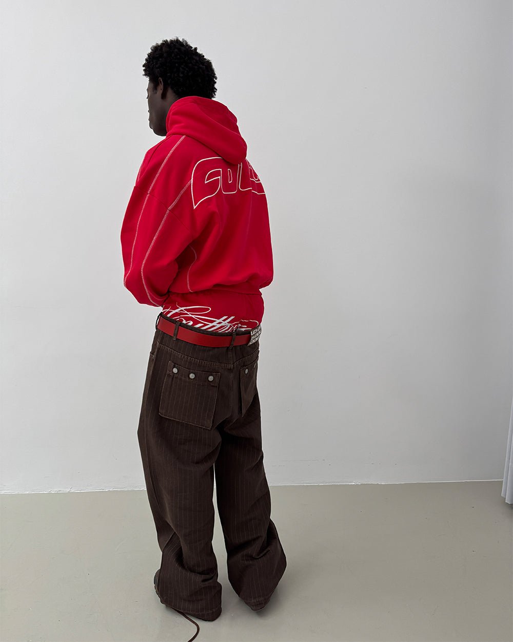 CASINO PANTS BROWN DENIM - brown pinstripe denim pants, back view on male model - Cold Culture