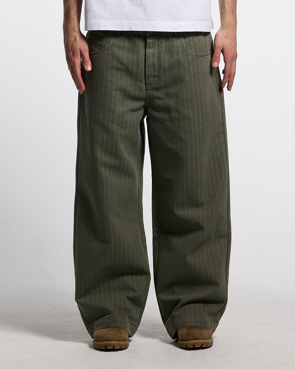 CASINO PANTS GREEN DENIM - green pinstripe denim pants, front view on male model - Cold Culture