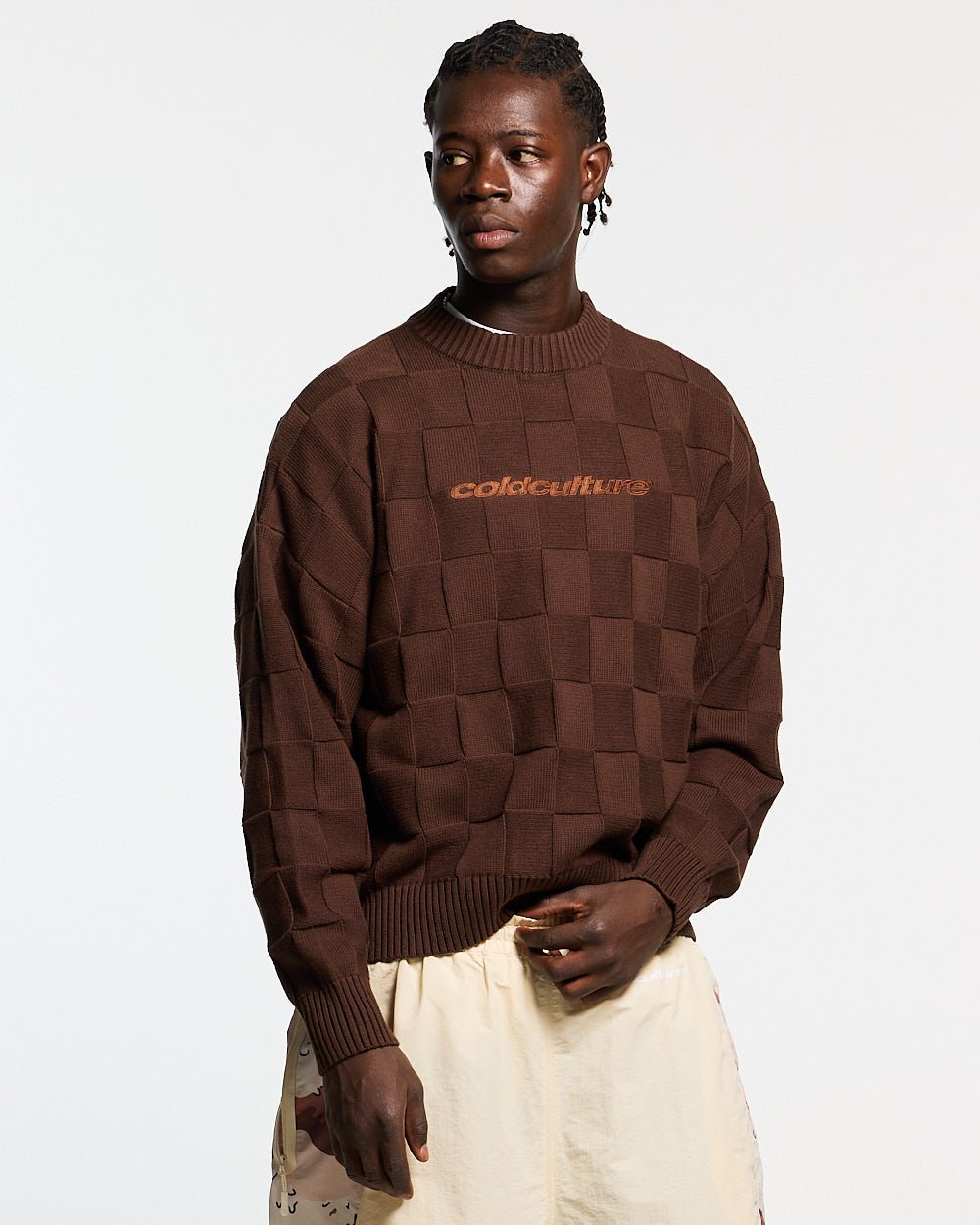 CHECKMATE KNITWEAR BROWN - brown checkerboard knit sweater, front view on male model - Cold Culture #man