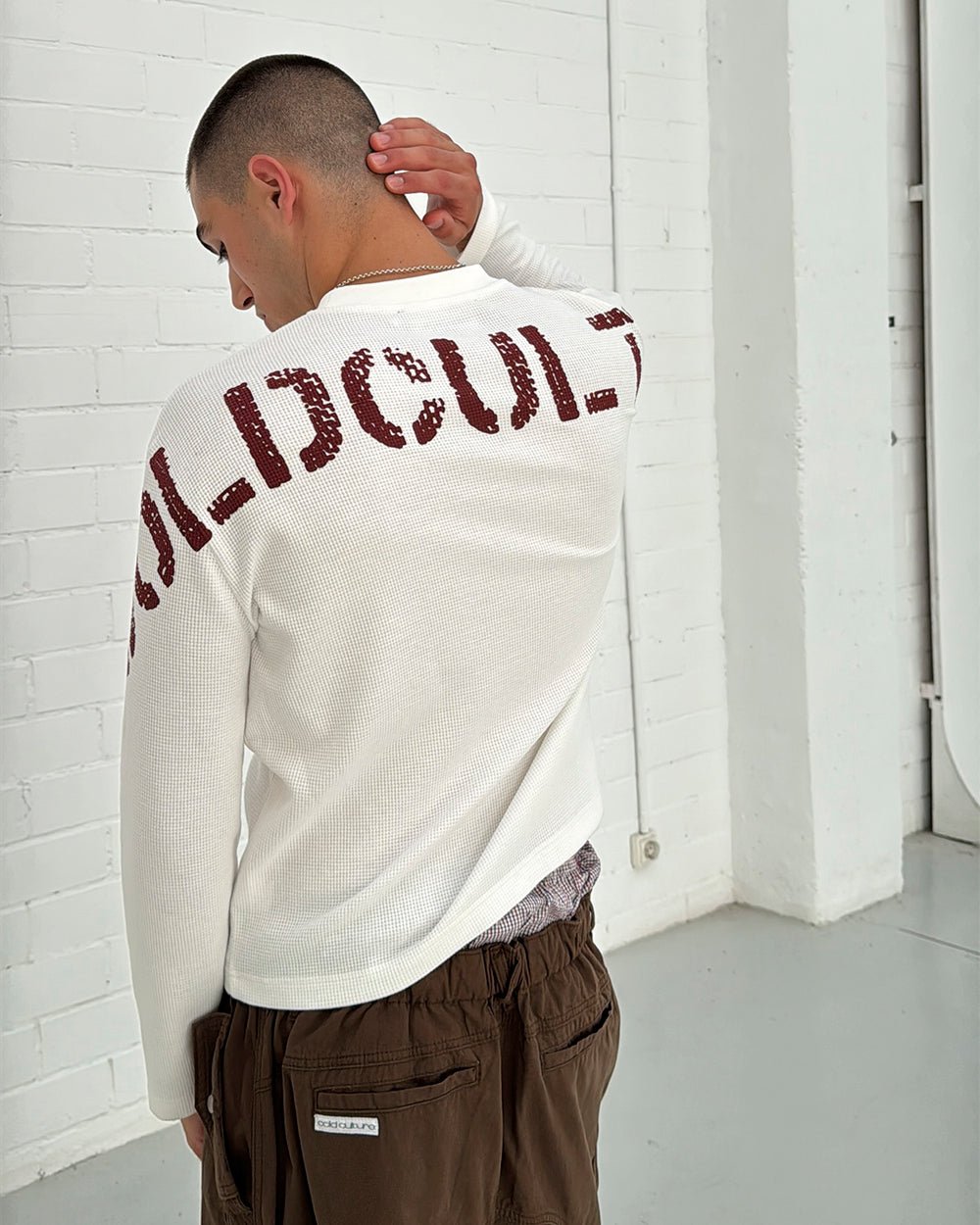 CIPHER LONGSLEEVE OFF-WHITE - off-white graphic print longsleeve tee, back view on male model - Cold Culture