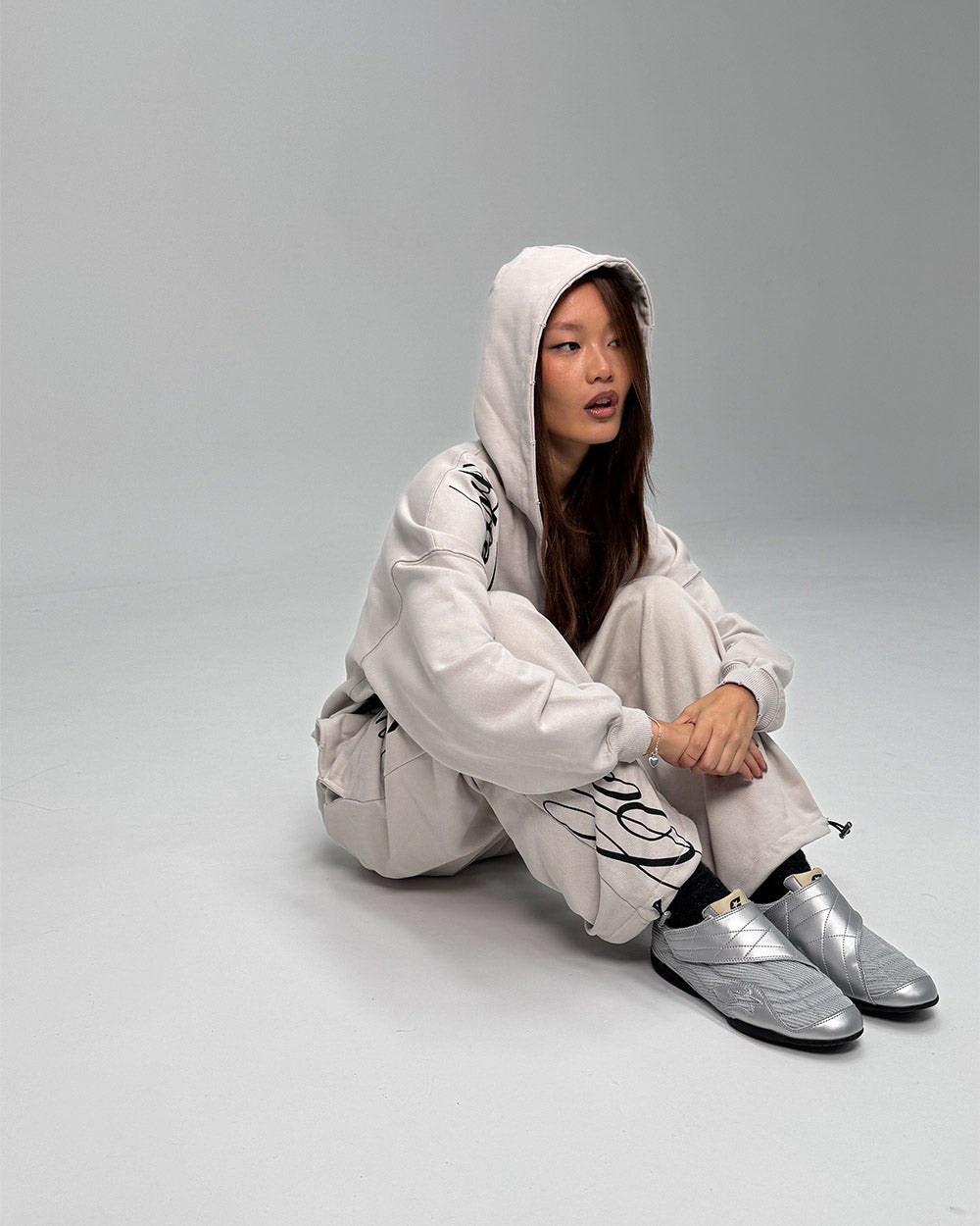 COLD HOOK SNEAKER SILVER - silver velcro strap sneakers, front view on female model - Cold Culture #woman