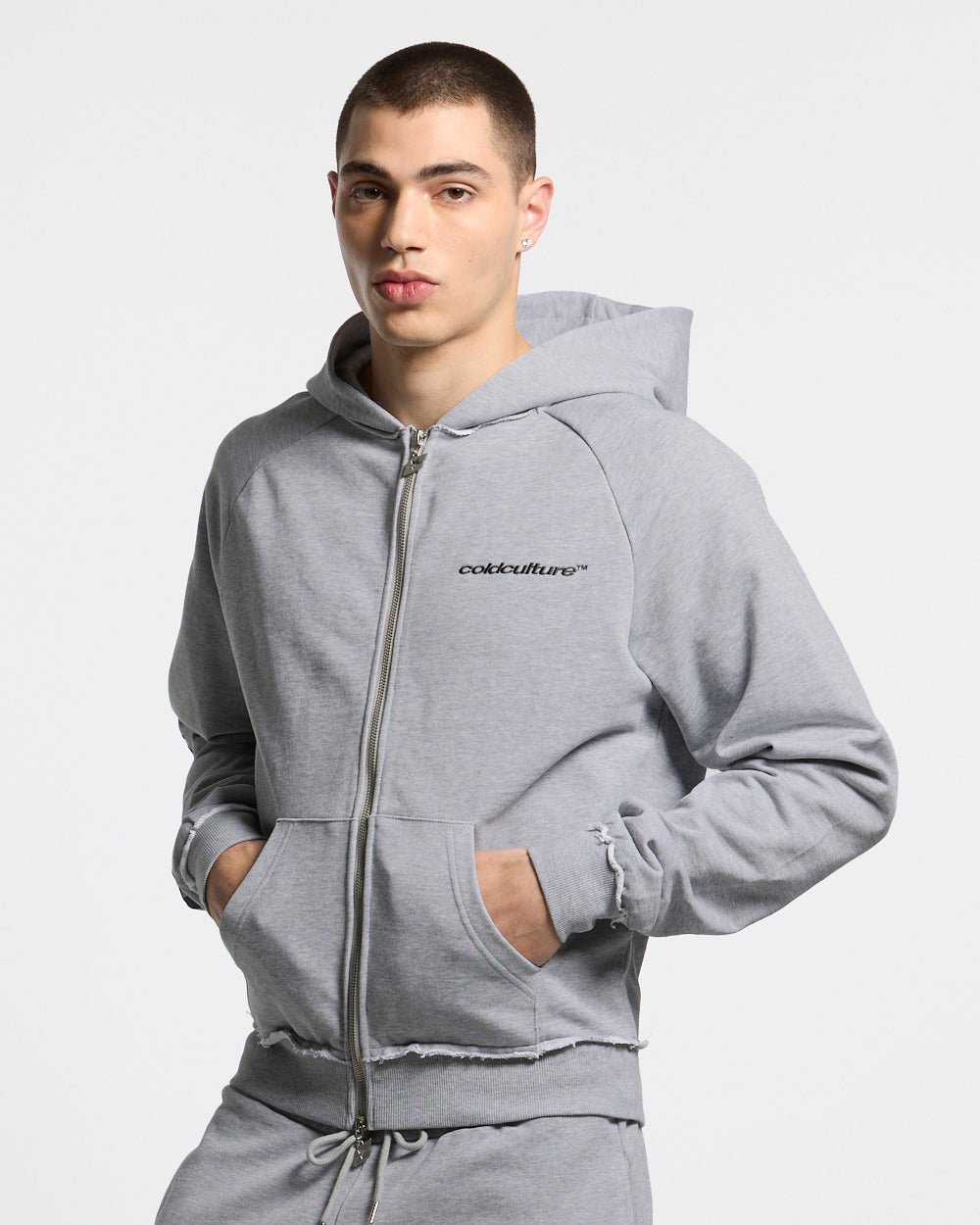 COLD SPORT ZIP HOODIE GREY - grey zip-up hoodie, front view on male model - Cold Culture #man