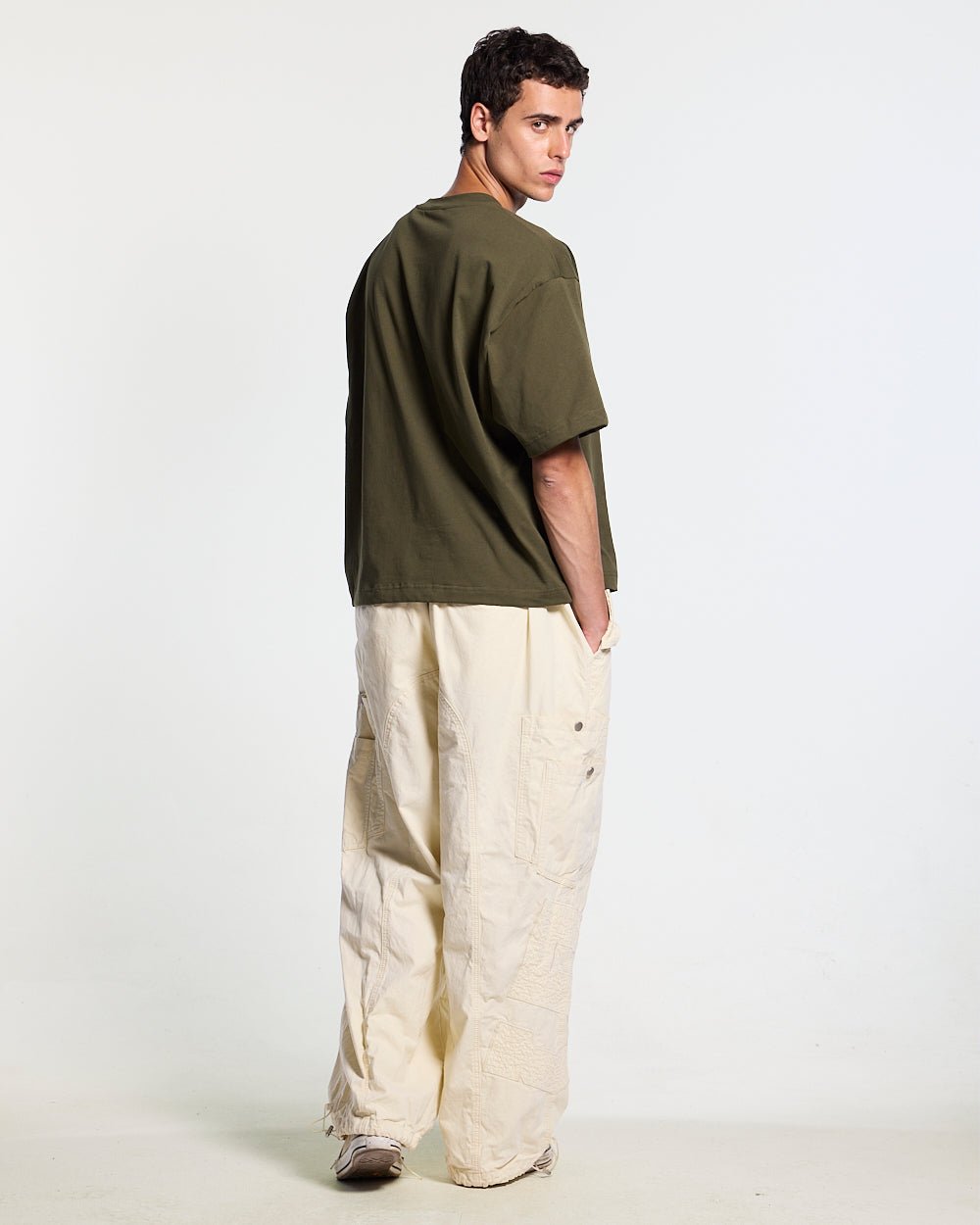 COLLECTIVE TEE GREEN - green graphic print tee, back view on male model - Cold Culture #man