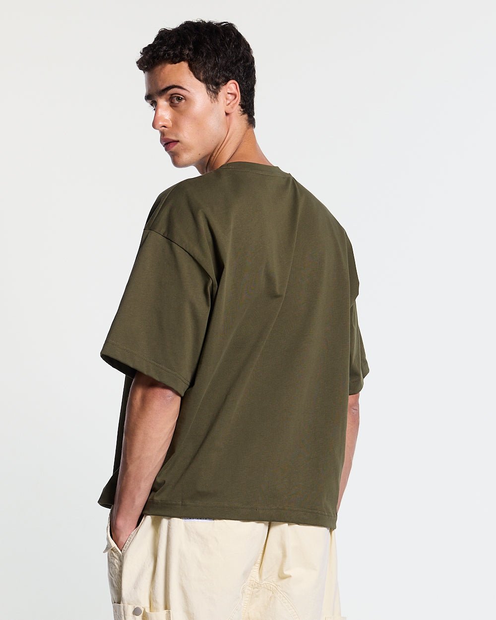 COLLECTIVE TEE GREEN - green graphic print tee, back view on male model - Cold Culture #man
