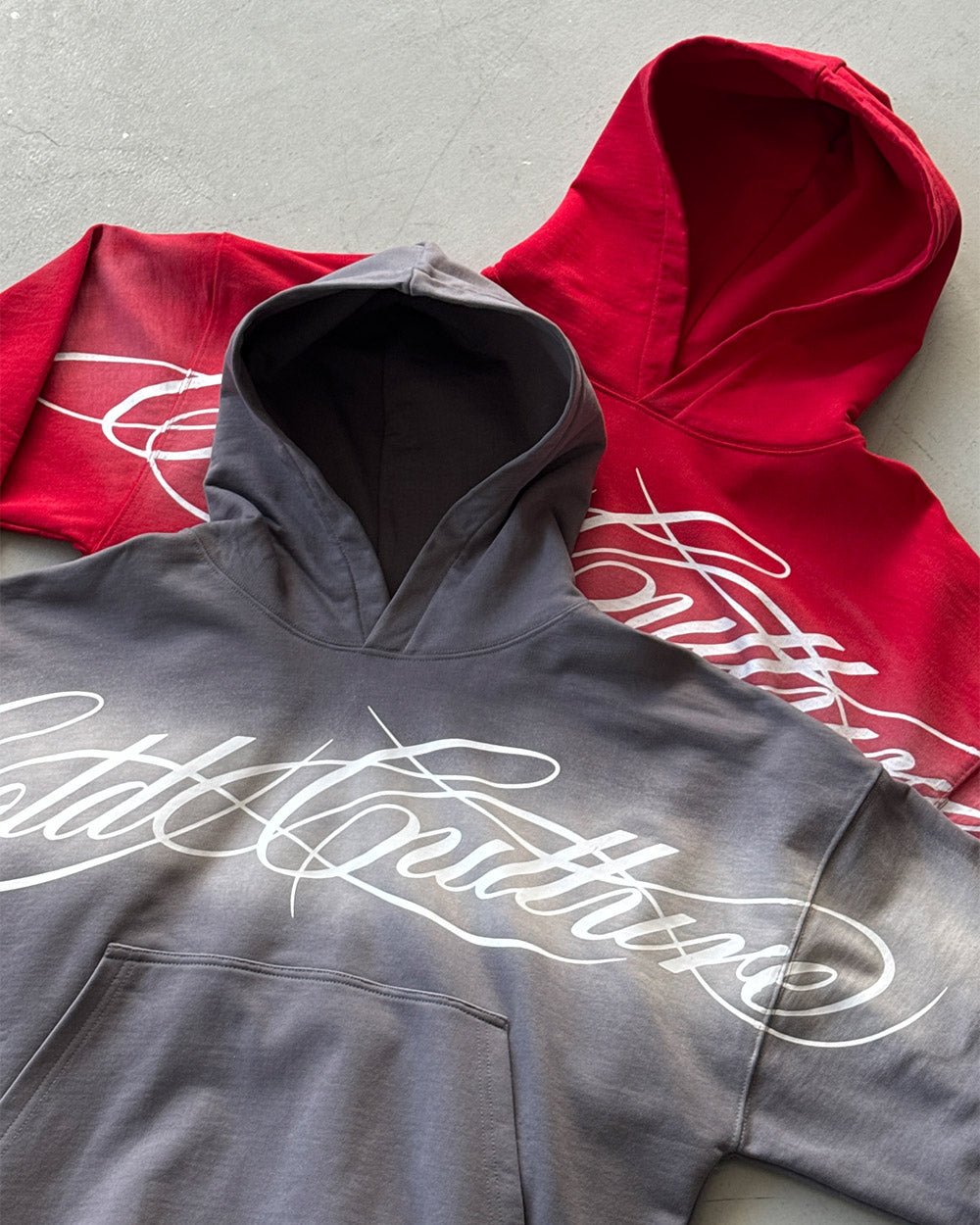 CROSSED SCRIPT HOODIE RED - red script print hoodie, flat lay with matching pieces - Cold Culture