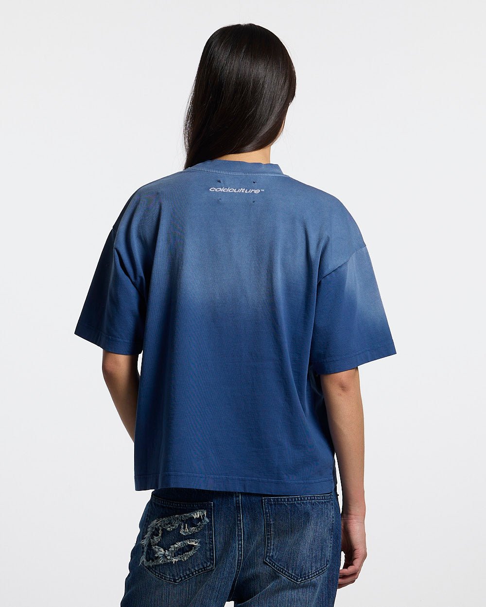 CROSSED SCRIPT TEE BLUE - washed blue tee, back view on female model - Cold Culture #woman