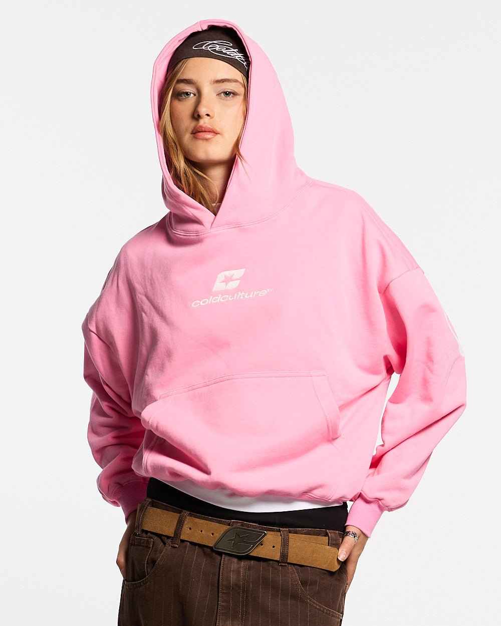 CURVED HOODIE PINK - pink oversized hoodie, front view on female model - Cold Culture #woman