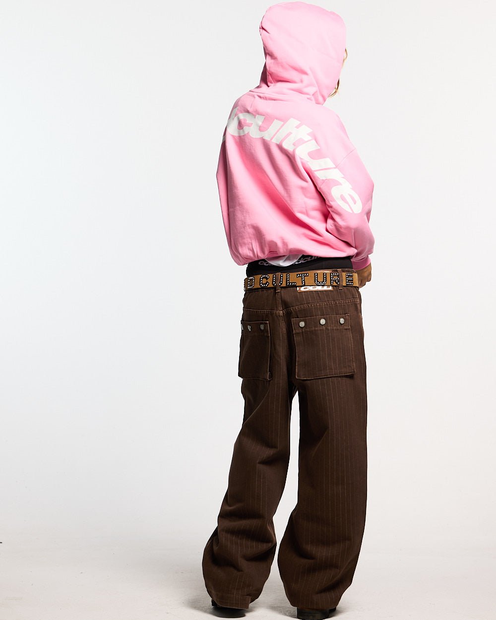 CURVED HOODIE PINK - pink oversized hoodie, back view on female model - Cold Culture #woman