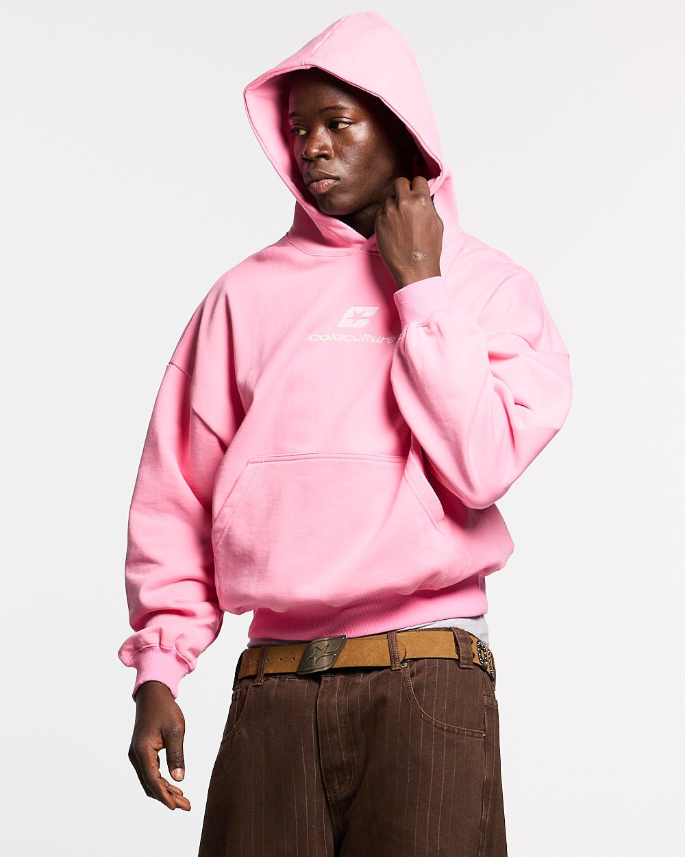 CURVED HOODIE PINK - pink oversized hoodie, front view on male model - Cold Culture #man