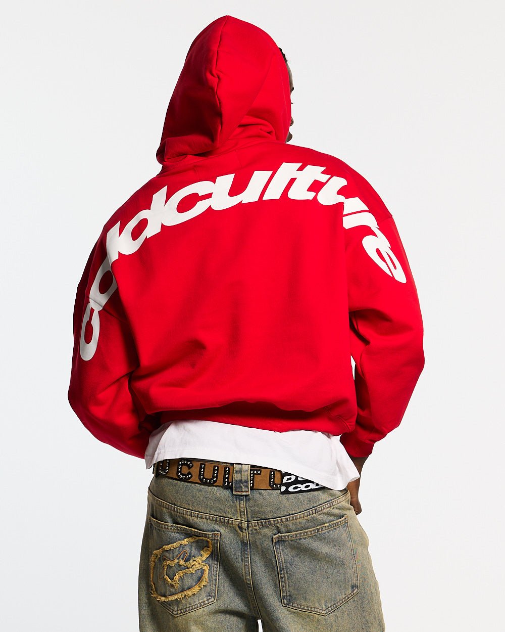 CURVED HOODIE RED - red oversized hoodie, back view on male model - Cold Culture