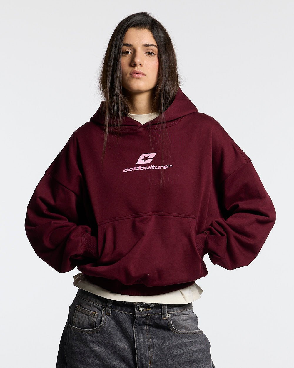 CURVED HOODIE WINE RED - wine red oversized hoodie, front view on female model - Cold Culture #woman