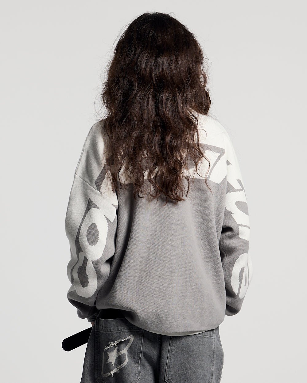 CURVED KNIT GREY & WHITE - grey and white knit sweater, back view on female model - Cold Culture #woman