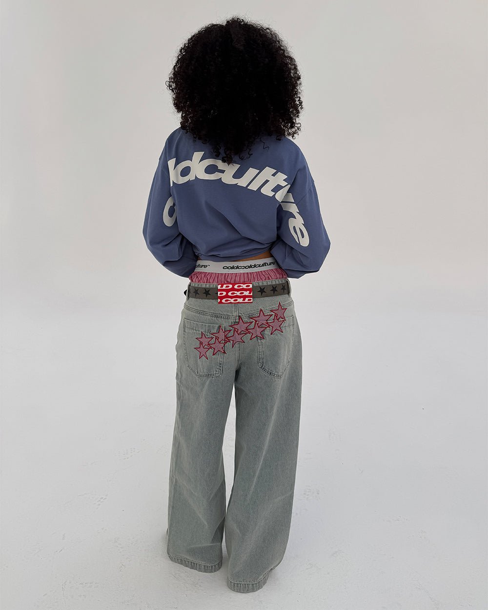 CURVED LONGSLEEVE BLUE - blue oversized longsleeve tee, back view on female model - Cold Culture #woman
