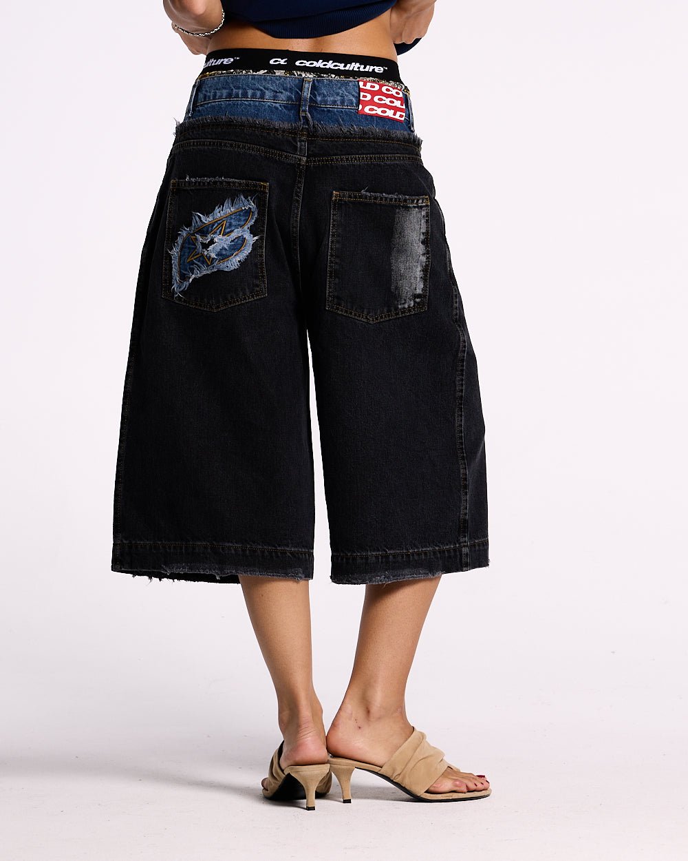 DARK SEA SHORT - baggy black denim shorts, back view on female model - Cold Culture #woman