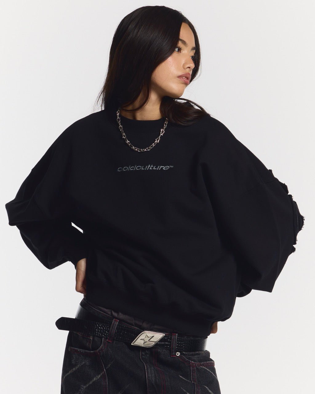 DISTRESS CURVED CREWNECK BLACK - black distressed crewneck sweatshirt, front view on female model - Cold Culture #woman