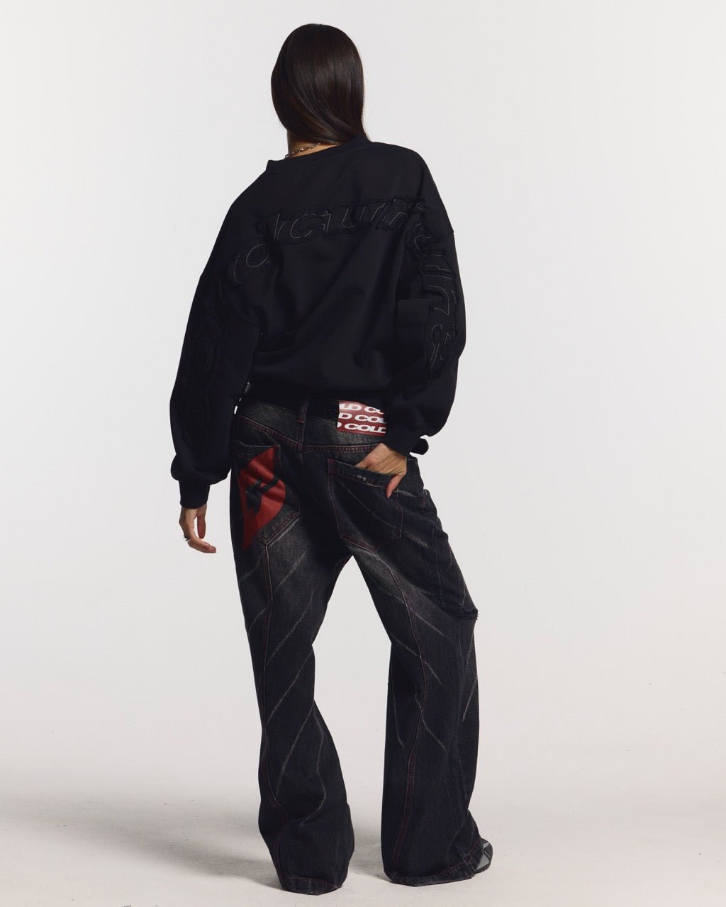 DISTRESS CURVED CREWNECK BLACK - black distressed crewneck sweatshirt, back view on female model - Cold Culture #woman