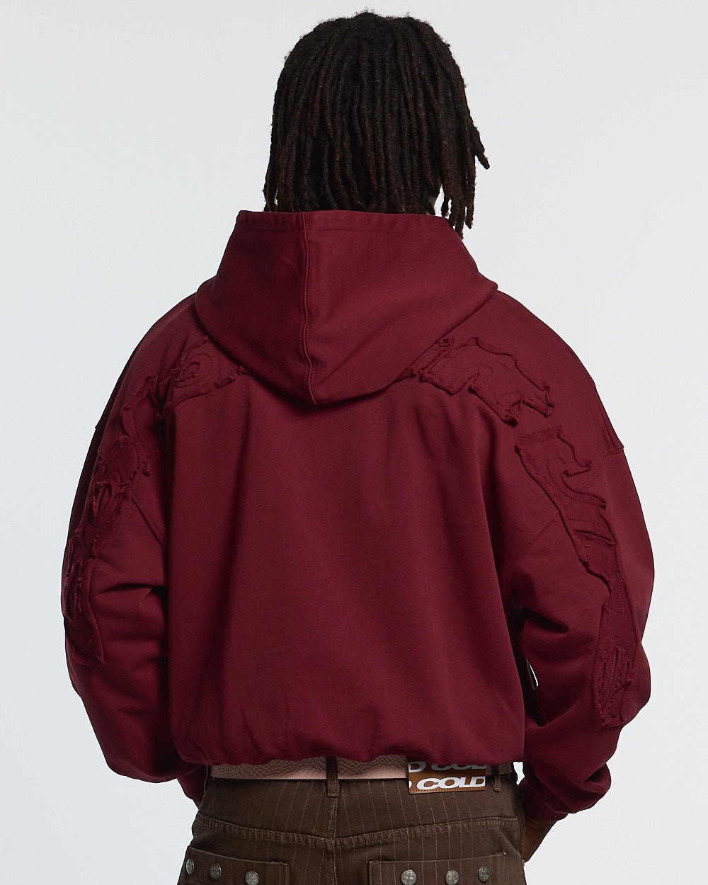 DISTRESS CURVED HOODIE BURGUNDY - burgundy distressed hoodie, back view on male model - Cold Culture #man