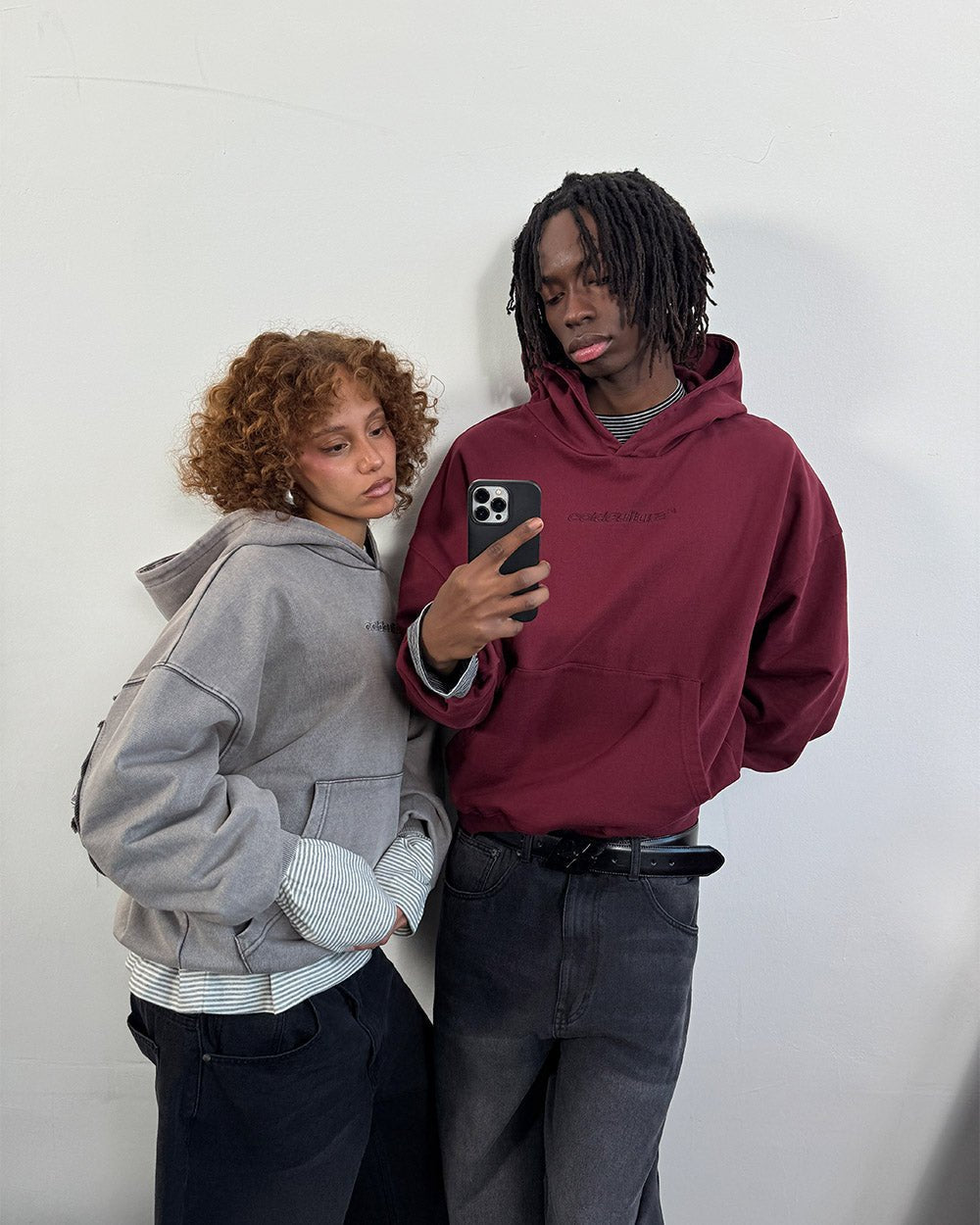 DISTRESS CURVED HOODIE BURGUNDY - burgundy distressed hoodie, front view on male model - Cold Culture #woman