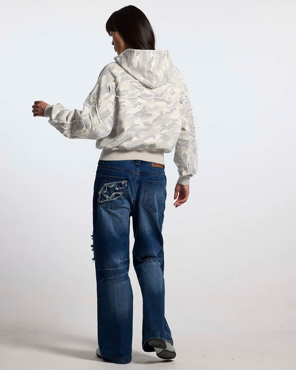 DISTRESS CURVED HOODIE CAMO GREY - grey camo hoodie, back view on female model - Cold Culture #woman
