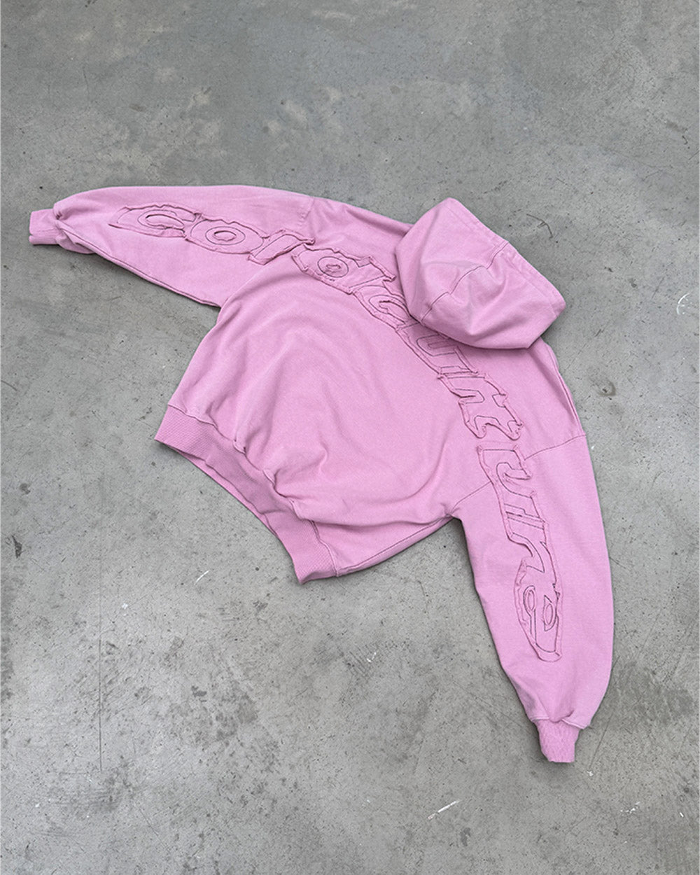 DISTRESS CURVED HOODIE PINK - pink distressed hoodie, flat lay - Cold Culture