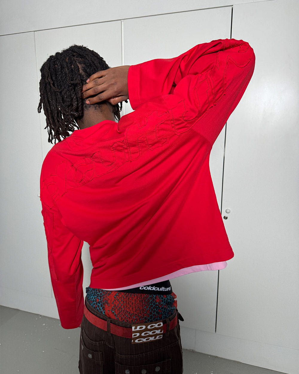 DISTRESS CURVED LONGSLEEVE RED - red distressed longsleeve tee, back view on male model - Cold Culture #man