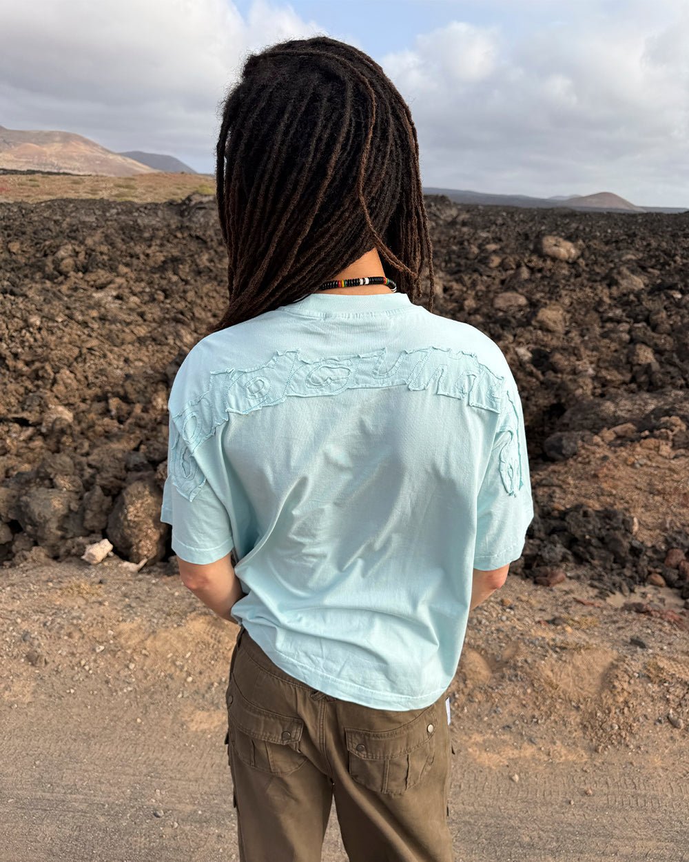 DISTRESS CURVED TEE BLUE - light blue distressed logo tee, street style shot - Cold Culture