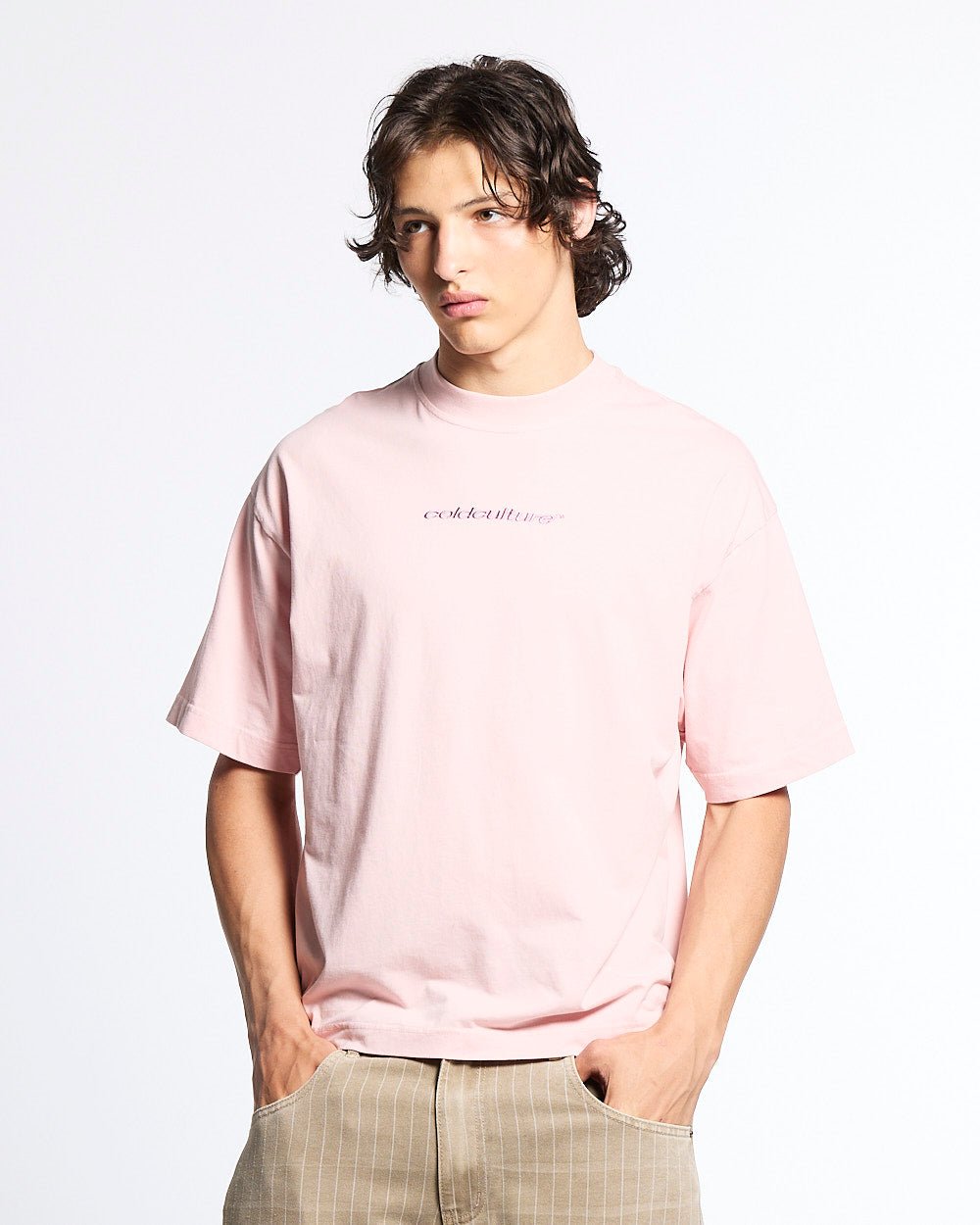 DISTRESS CURVED TEE PINK - pink distressed logo tee, front view on male model - Cold Culture #man