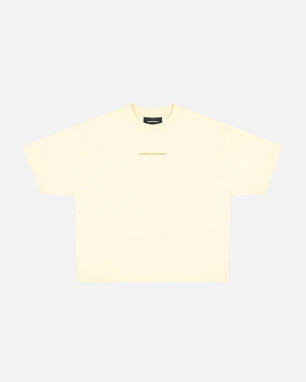 DISTRESS CURVED TEE YELLOW - pale yellow distressed tee, flat lay - Cold Culture #packshot
