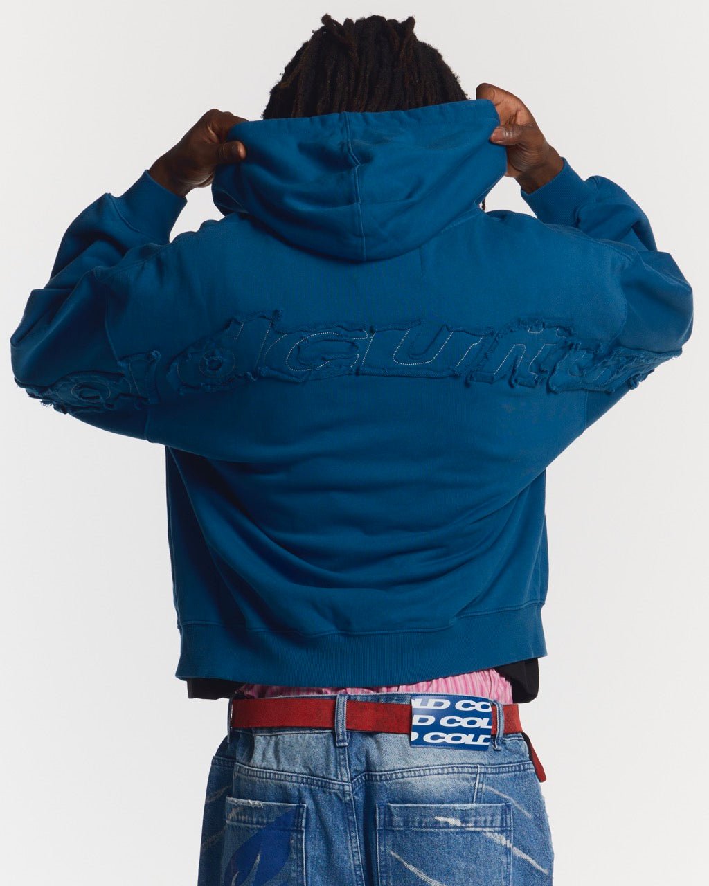 DISTRESS CURVED ZIP HOODIE DARK BLUE - dark blue distressed zip-up hoodie, back view on male model - Cold Culture