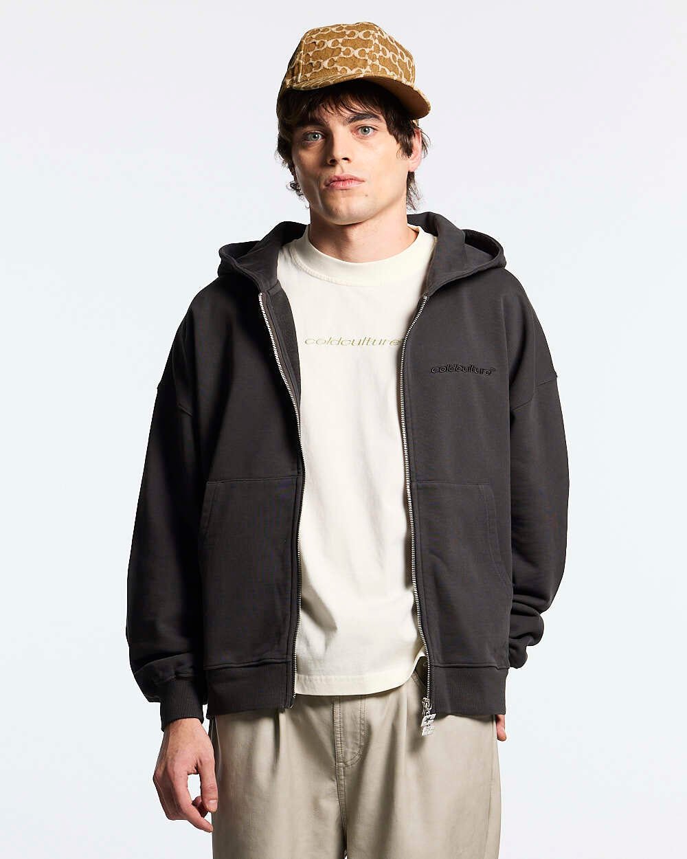 DISTRESS CURVED ZIP HOODIE DARK GREY - dark grey distressed zip-up hoodie, front view on male model - Cold Culture #man